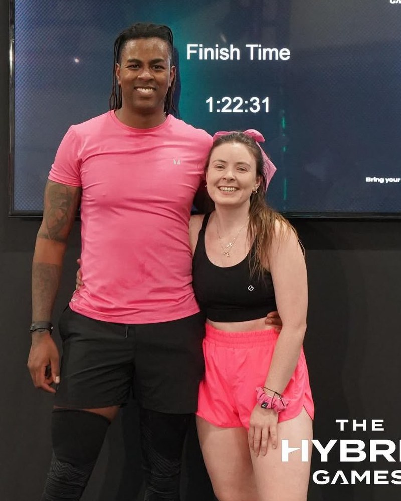 Sinead and Yas together after an event, in front of a finish-time board