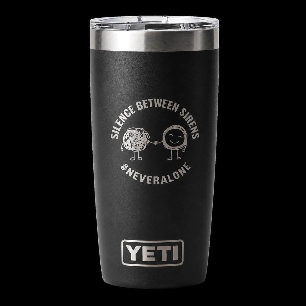 Black Yeti Rambler tumbler on a dark background, engraved with Silence Between Sirens, the #NeverAlone characters and the Yeti logo